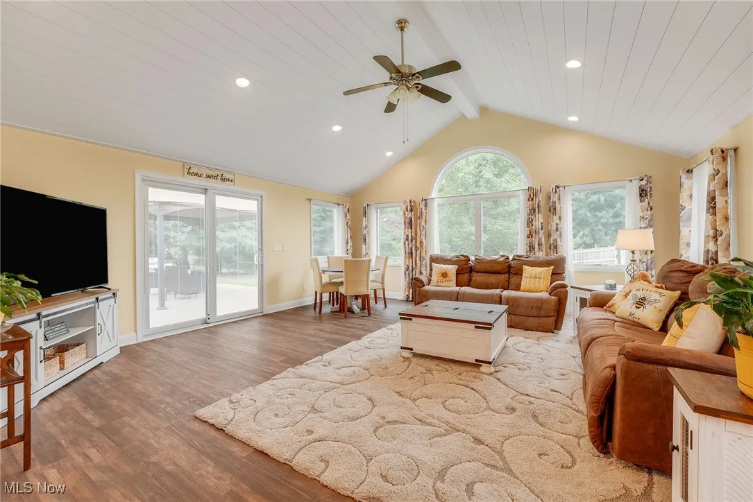 family roomfeaturing luxury vinyl floors, ceiling fan, and recessed led lighting