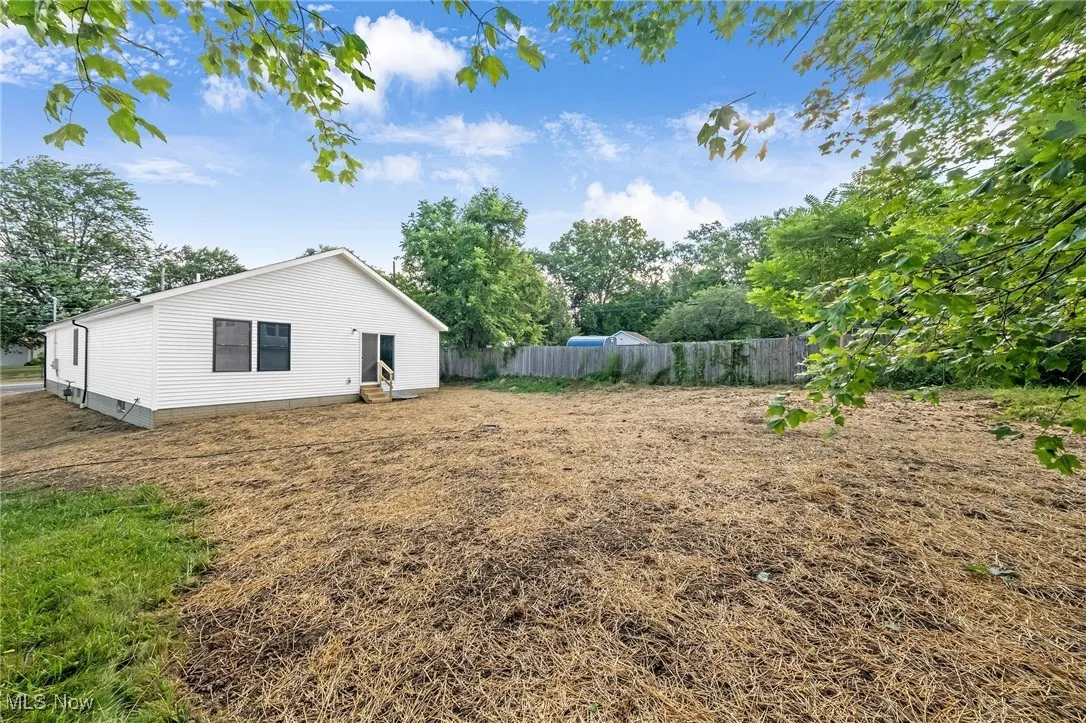 View of yard with entry steps