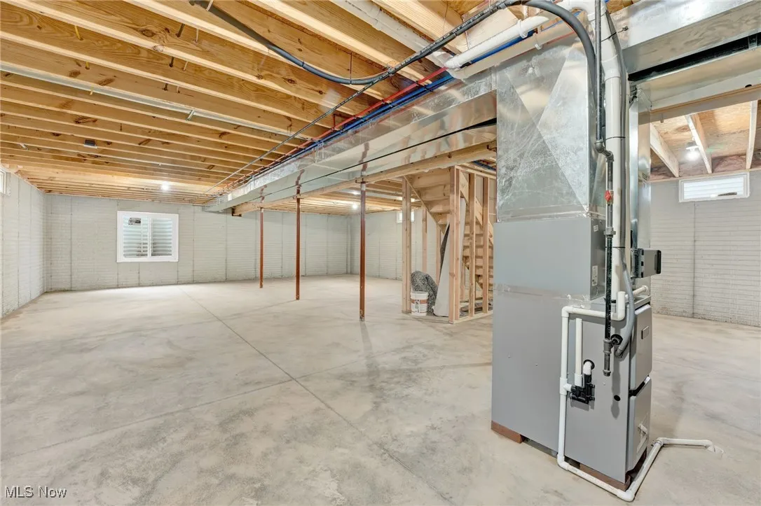 Below grade area featuring heating unit