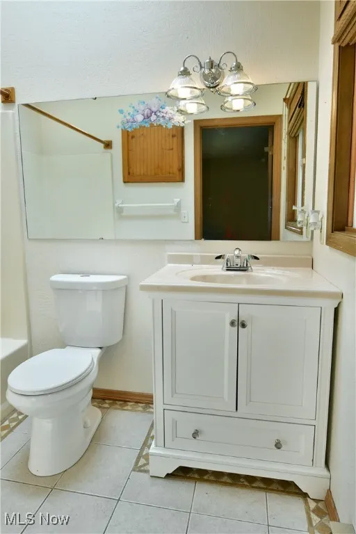 Bathroom featuring vanity and tile patterned floors