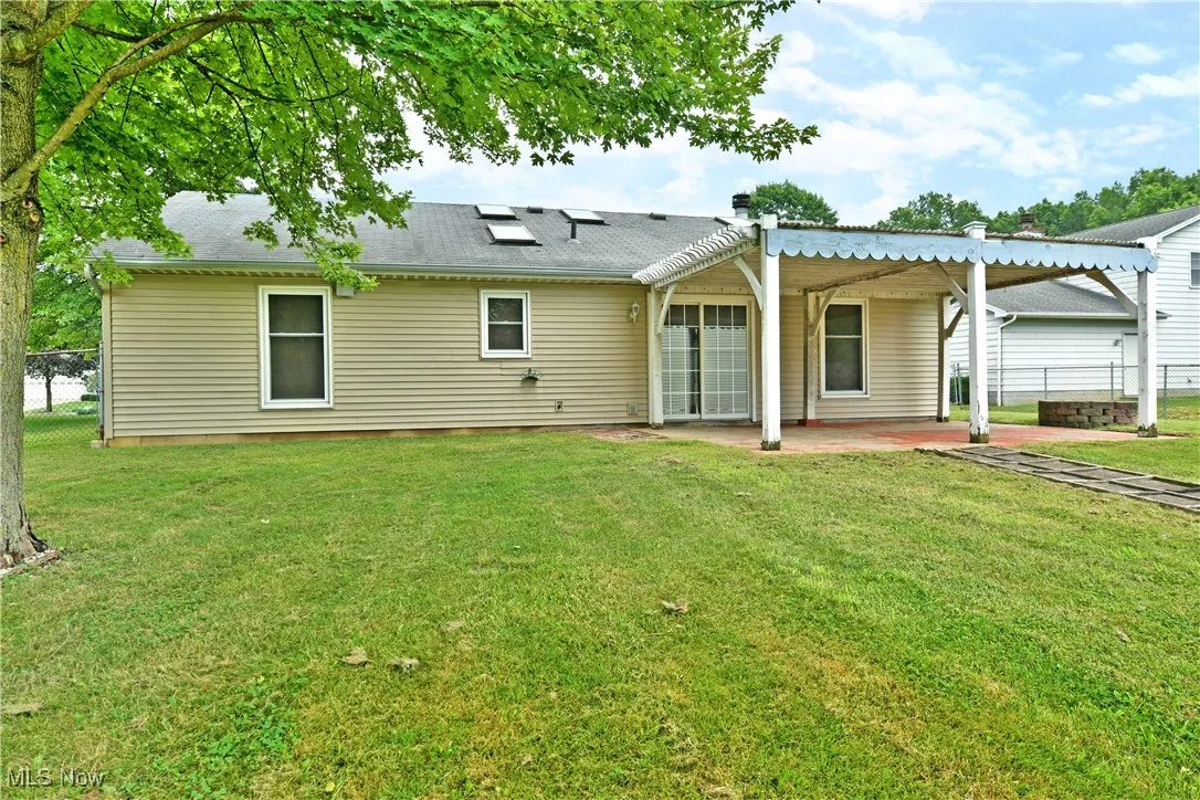 Rear view of house featuring a patio area