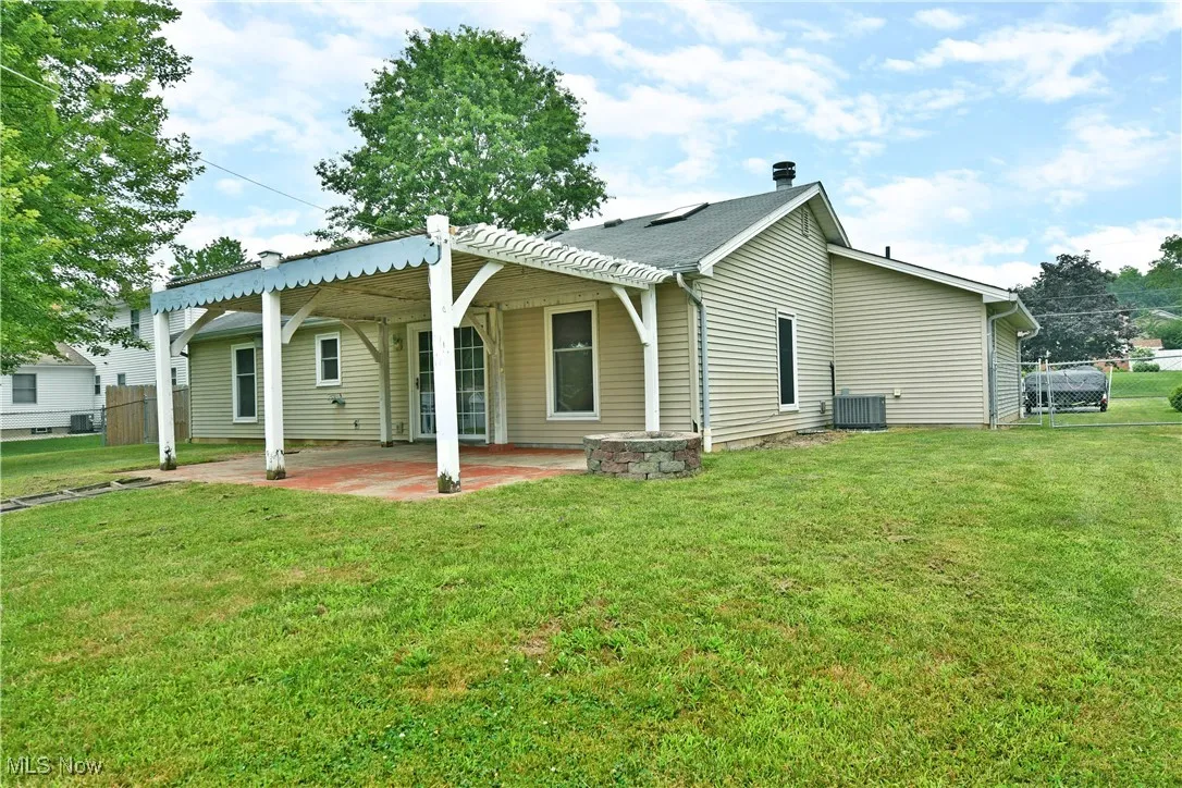 Back of property with a patio