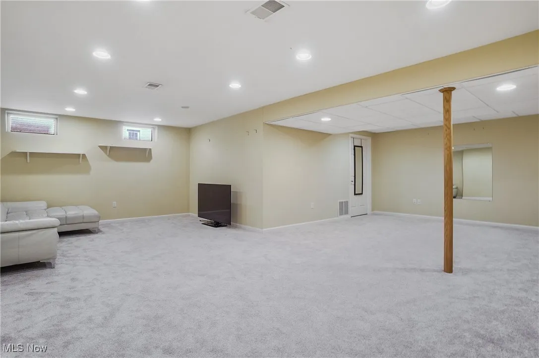 Basement featuring light carpet and recessed lighting