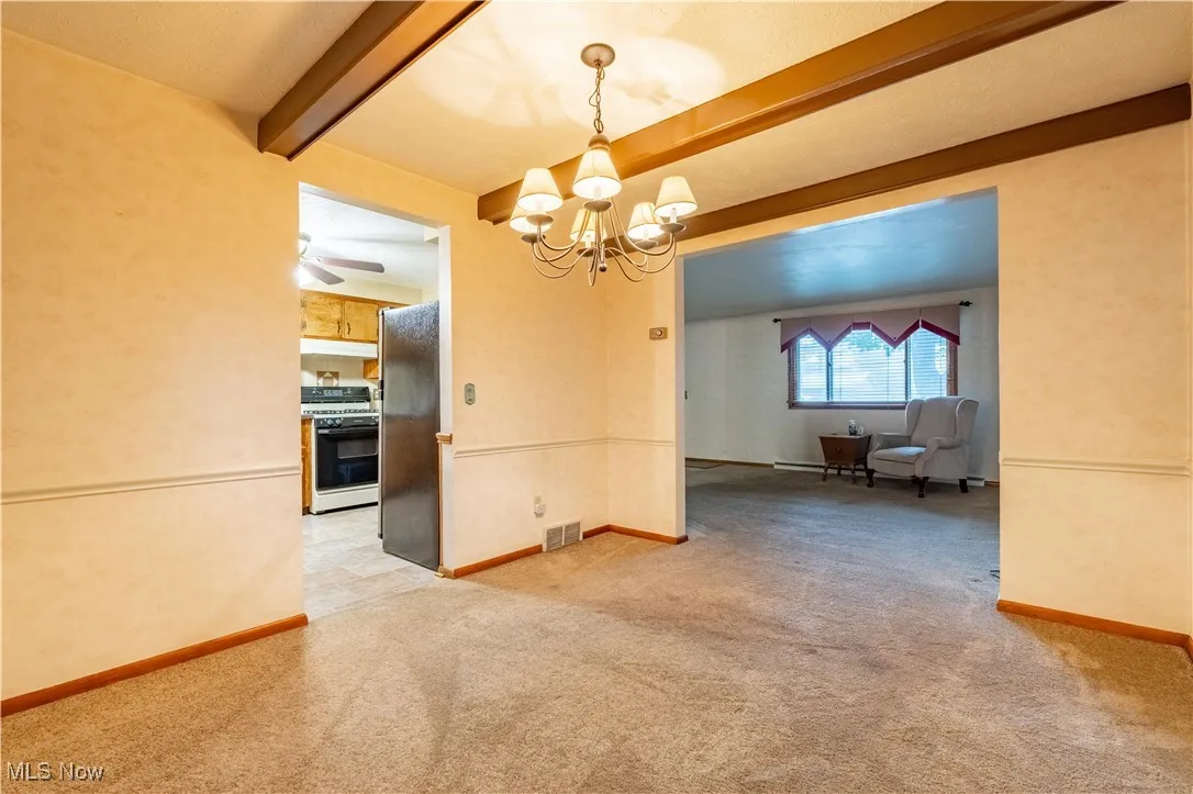 Dining room with beamed ceiling