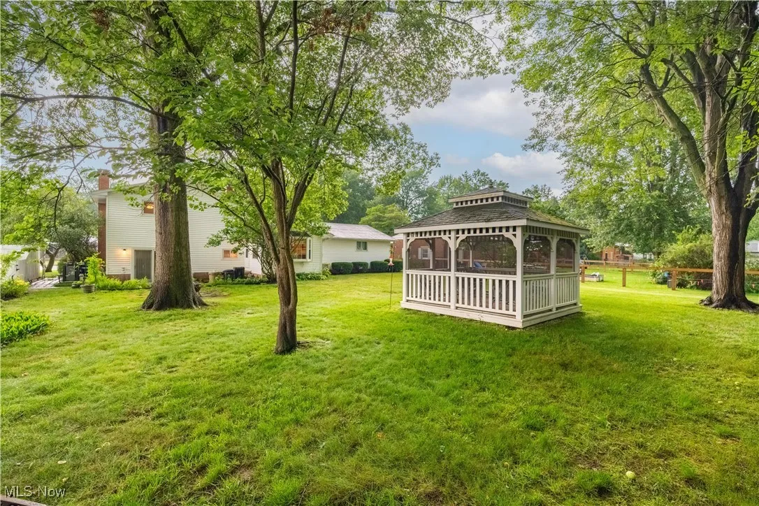 View of green lawn featuring a gazebo