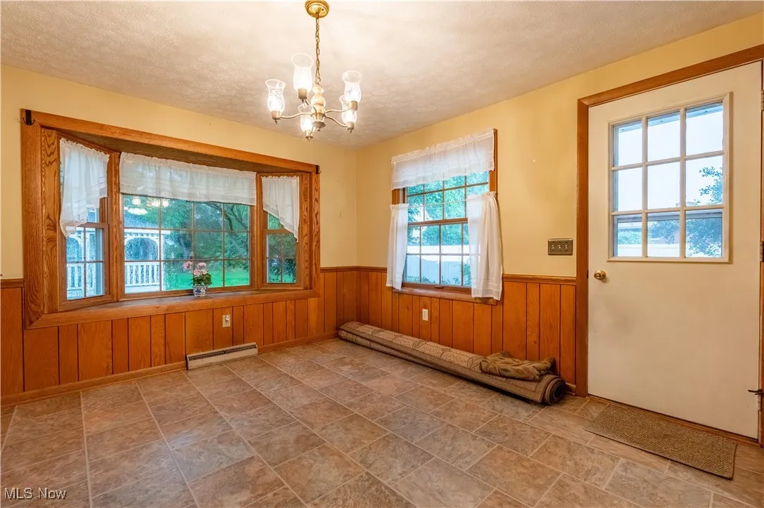 Kitchen addition with bay windows and access to backyard and pool area