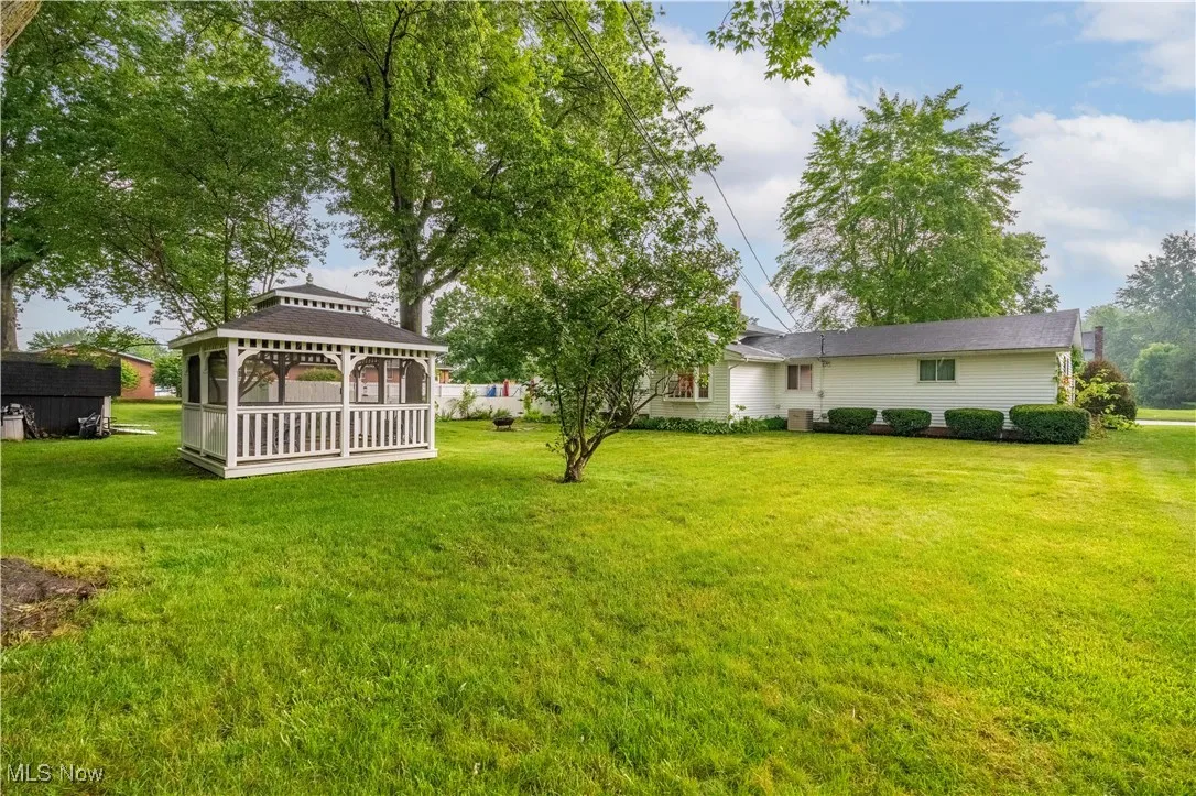 View of green lawn featuring a gazebo