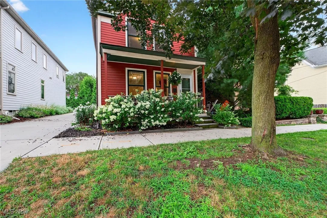 View of front of house featuring a porch and concrete driveway