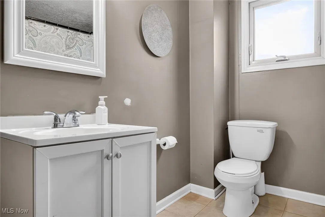 Bathroom with vanity and tile patterned flooring