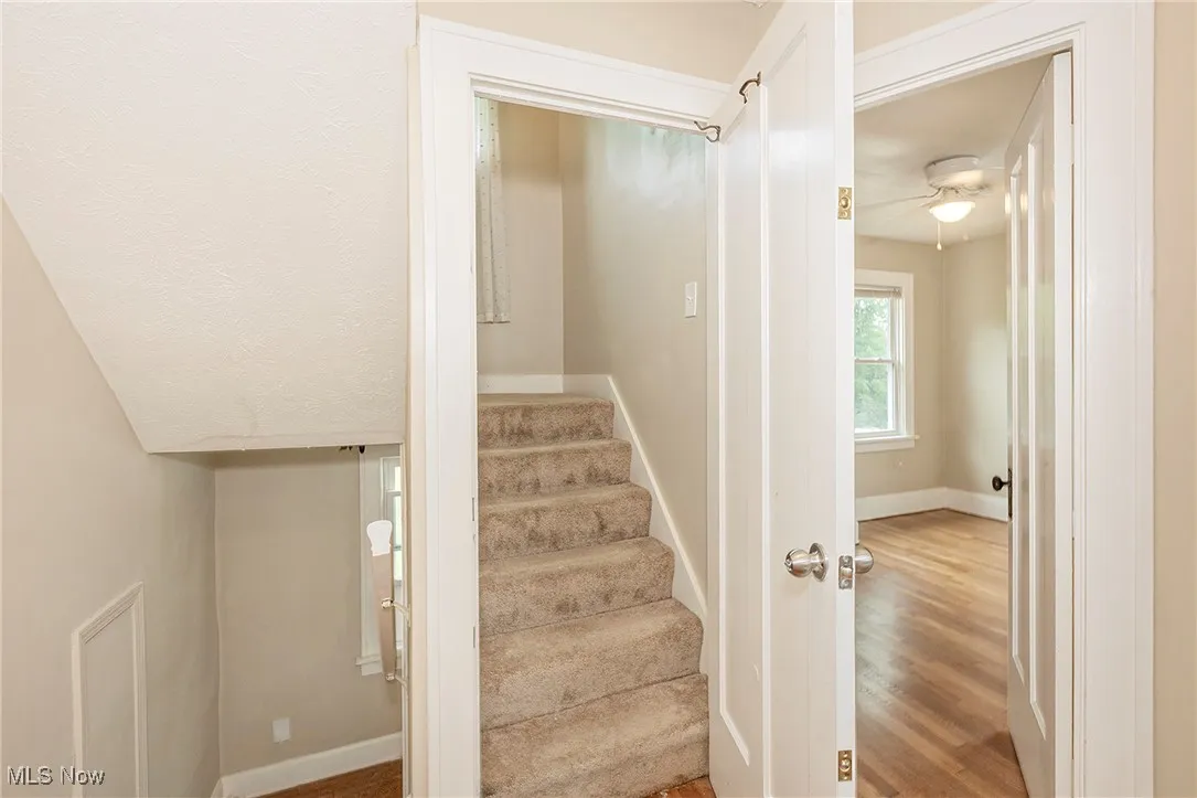 2nd floor landing and carpeted stairs leading to the 3rd floor.