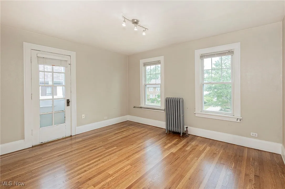 The 2nd floor bedroom with french door to the balcony.