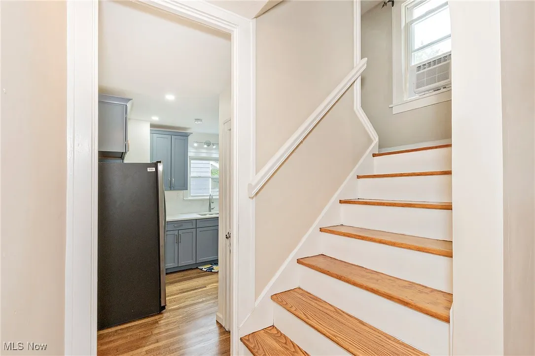 The transition to the 2nd floor and entry to the eat in kitchen.