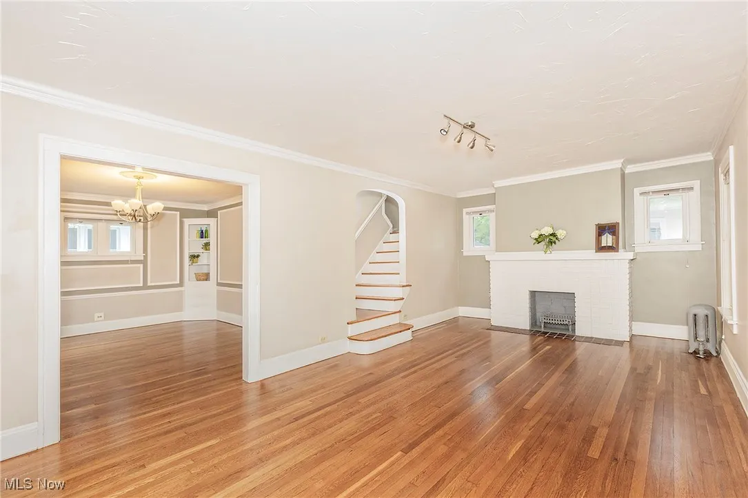 Another view of the living room and view into the dining room on the left