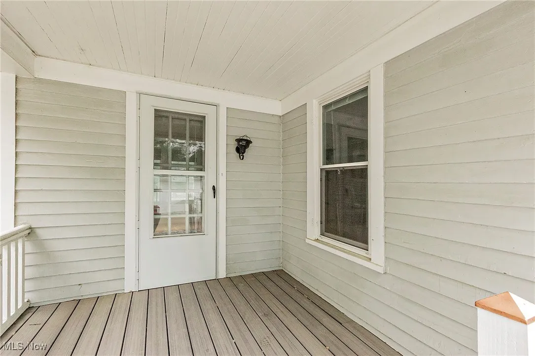 The back porch and door leading to the bonus room on the main level