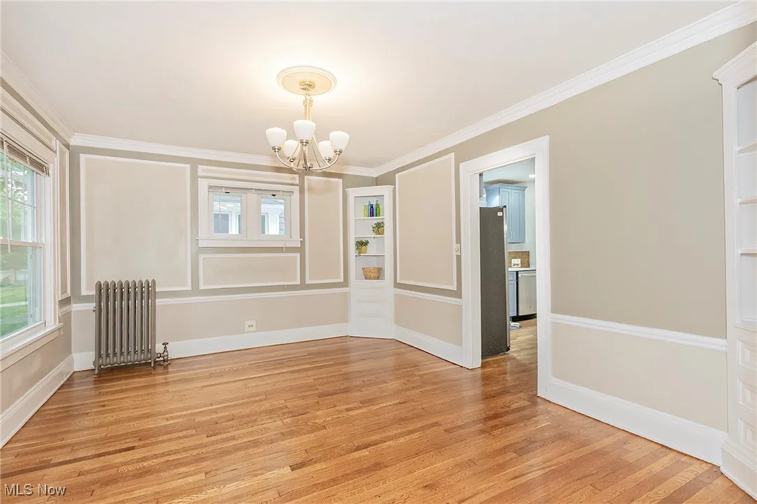 The dining room features built in cabinets and more recently refinished hardwood flooring.