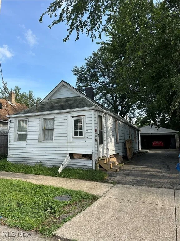View of front of property featuring entry steps and a chimney