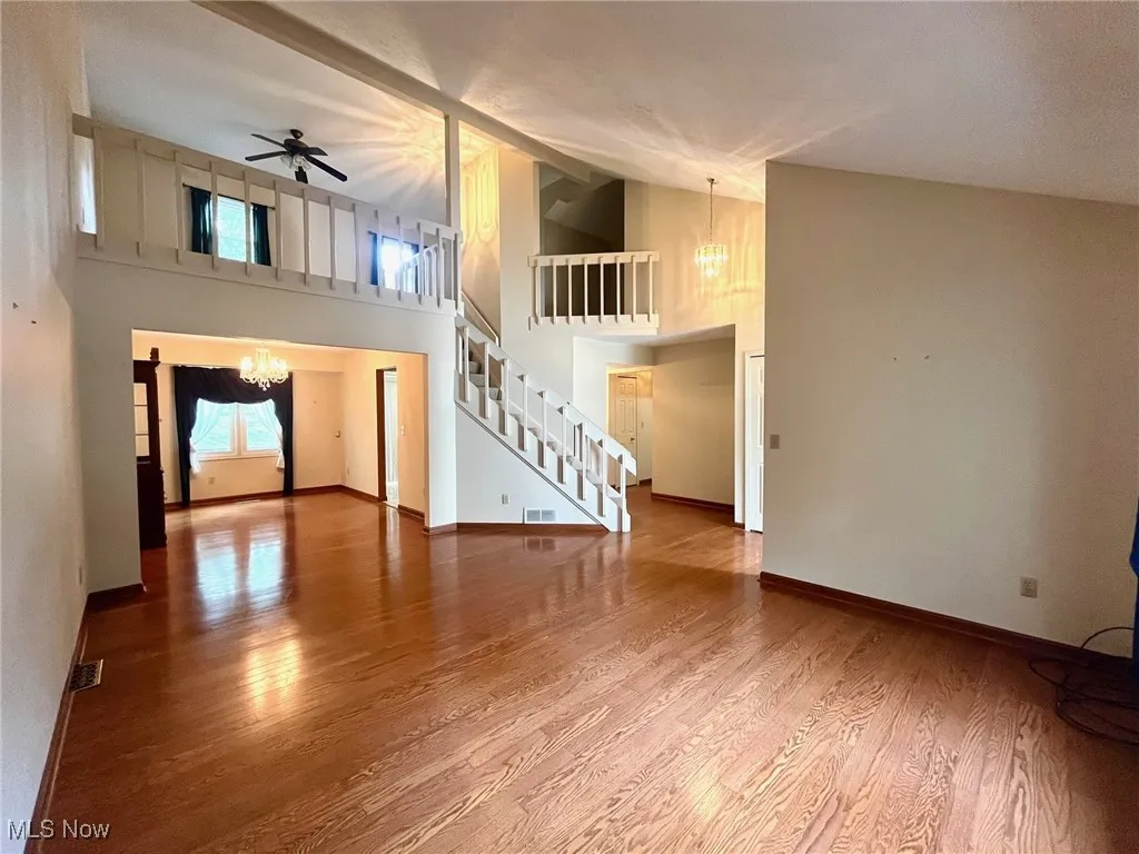 Great room with view of loft and dining room