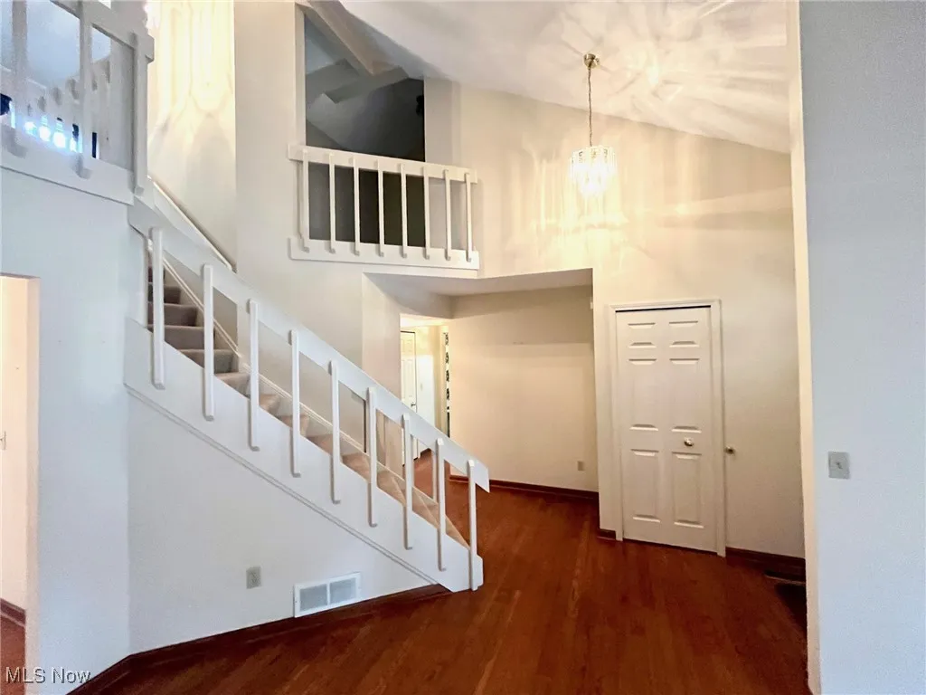 View of entry, staircase and front closet