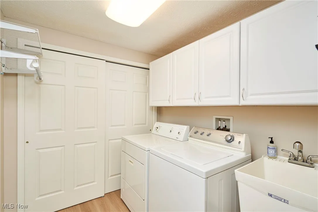 First Floor Laundry off of garage entrance with new flooring and utility (furnace/hot watter tank) closet.  Coat closet is just past the laundry room.