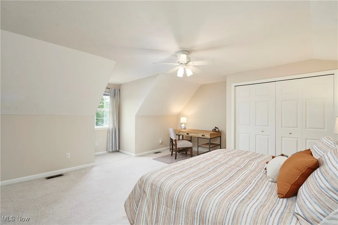 Second floor Bedroom featuring dormer, desk nook and nice closet.