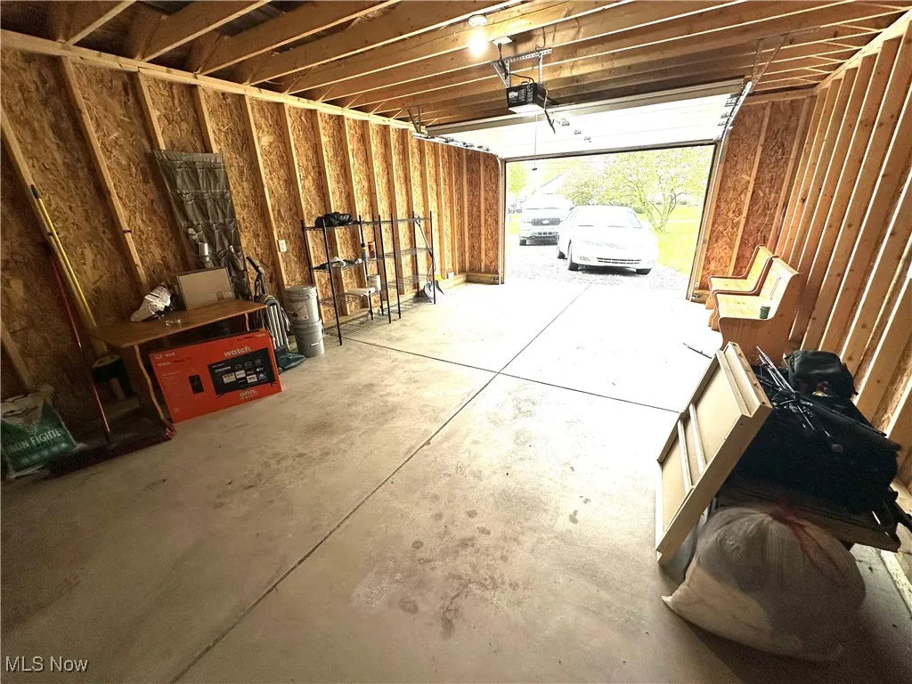 Garage featuring a garage door opener