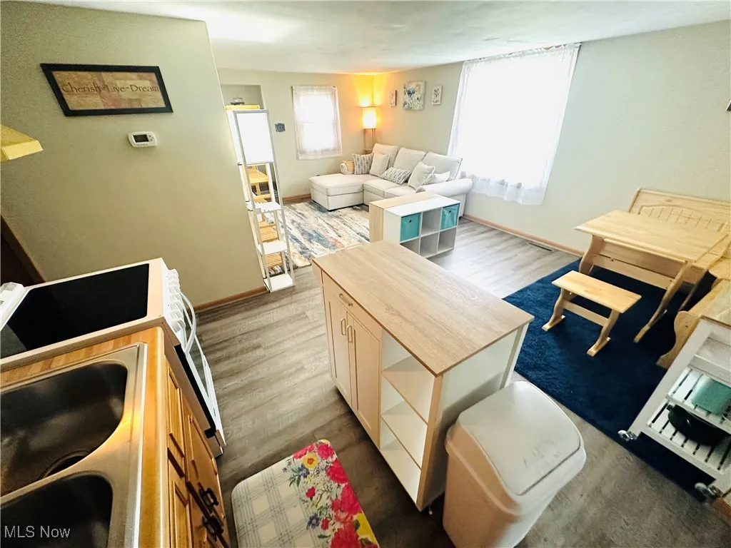Living room featuring wood finished floors and baseboards