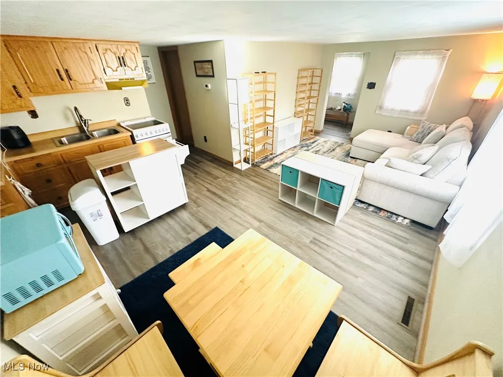 Living area with light wood-type flooring