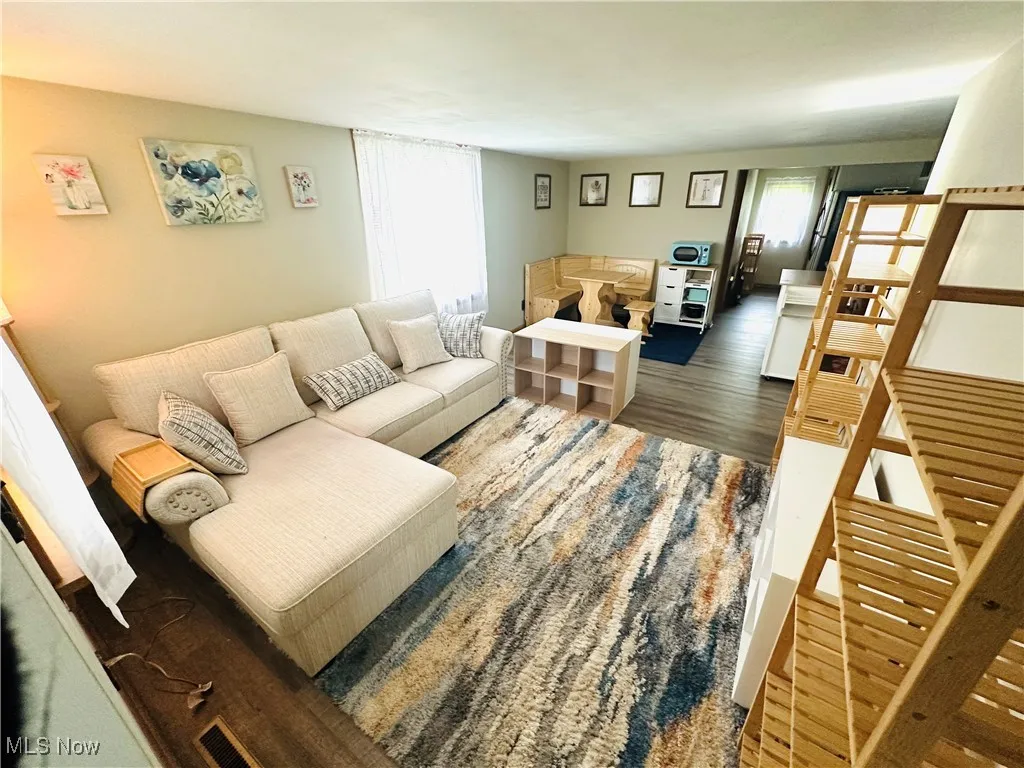 Living room featuring wood finished floors