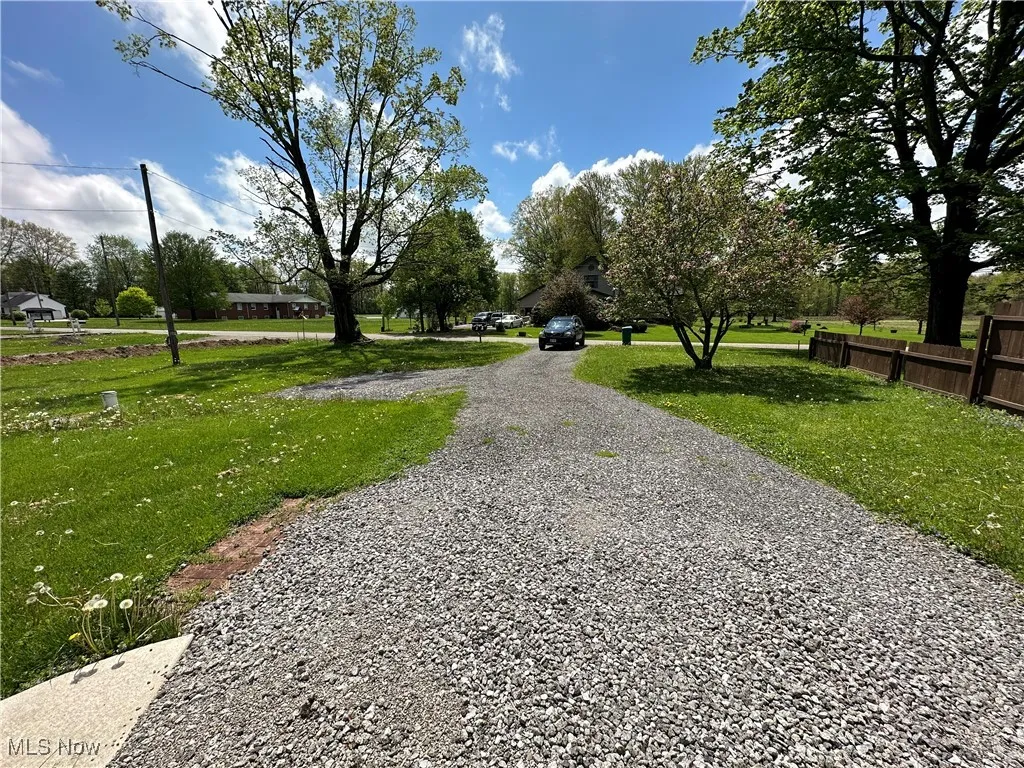 View of community featuring driveway