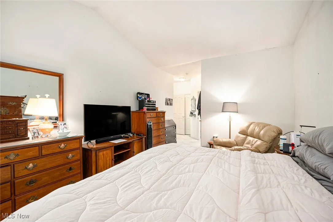Bedroom with vaulted ceiling