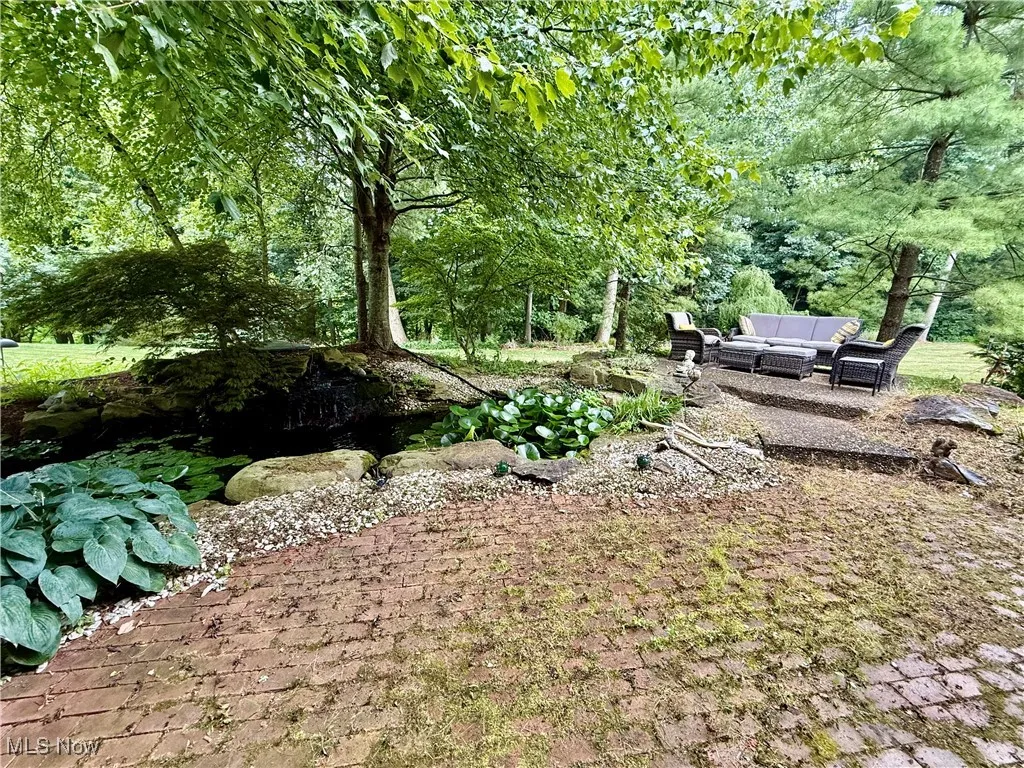 View of yard featuring an outdoor hangout area and a patio area