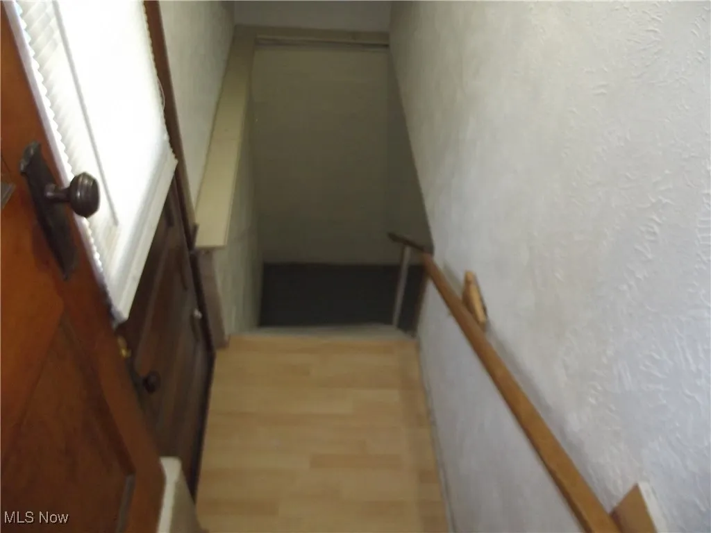 Staircase featuring light hardwood / wood-style floors