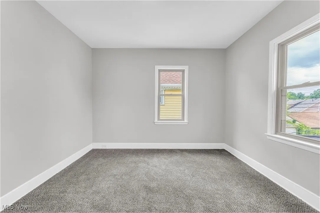 Spare room featuring carpet flooring
