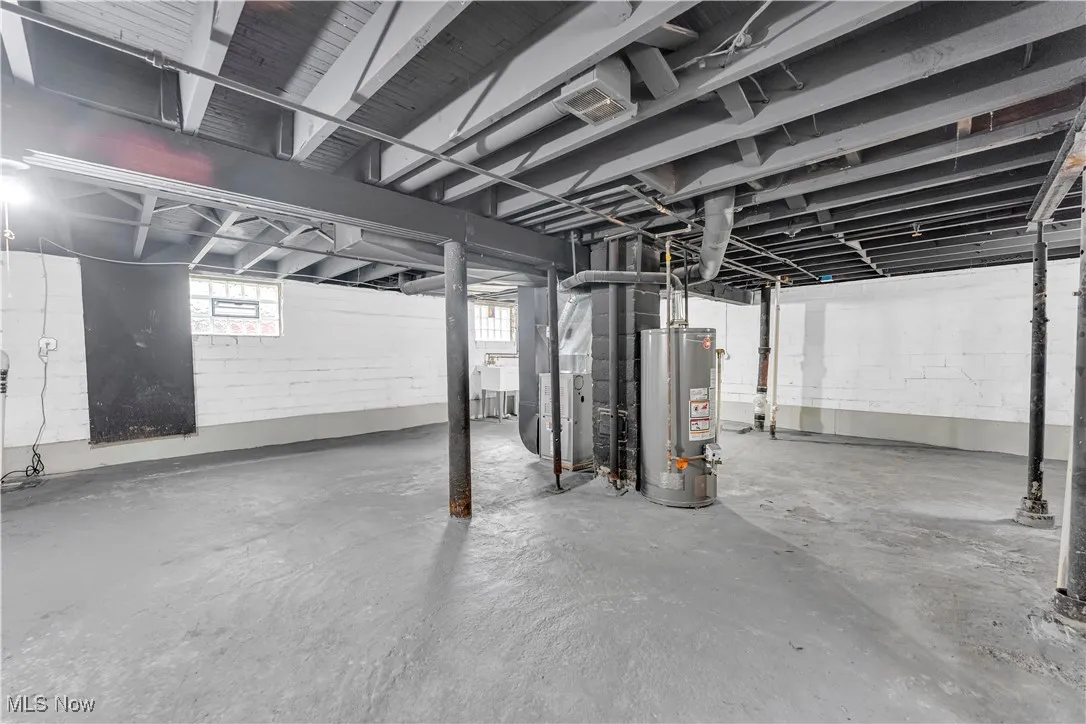 Below grade area with water heater and heating unit