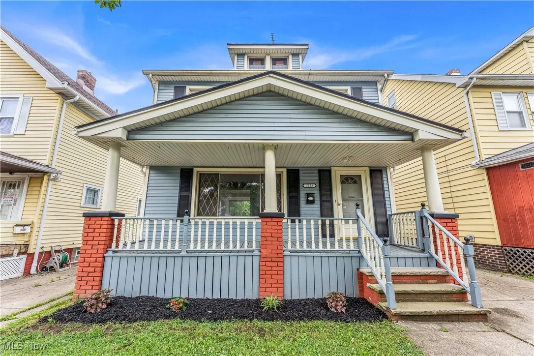 American foursquare style home with a porch