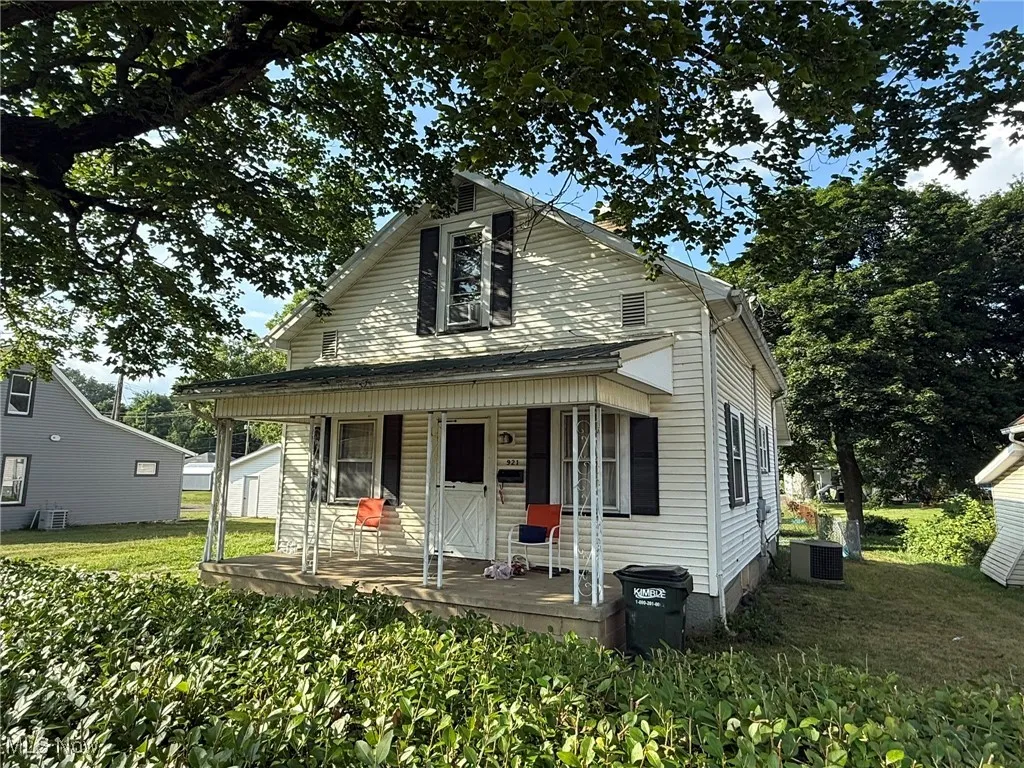 Bungalow-style house with covered porch and a front lawn