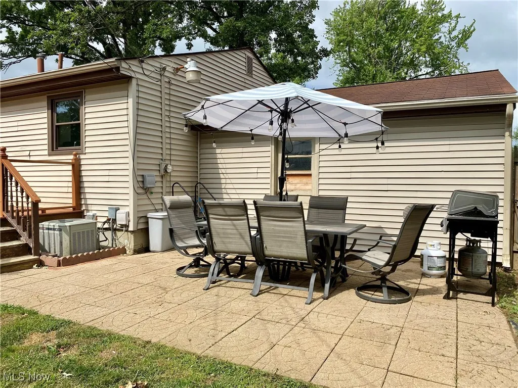 View of patio / terrace featuring a grill and outdoor dining space