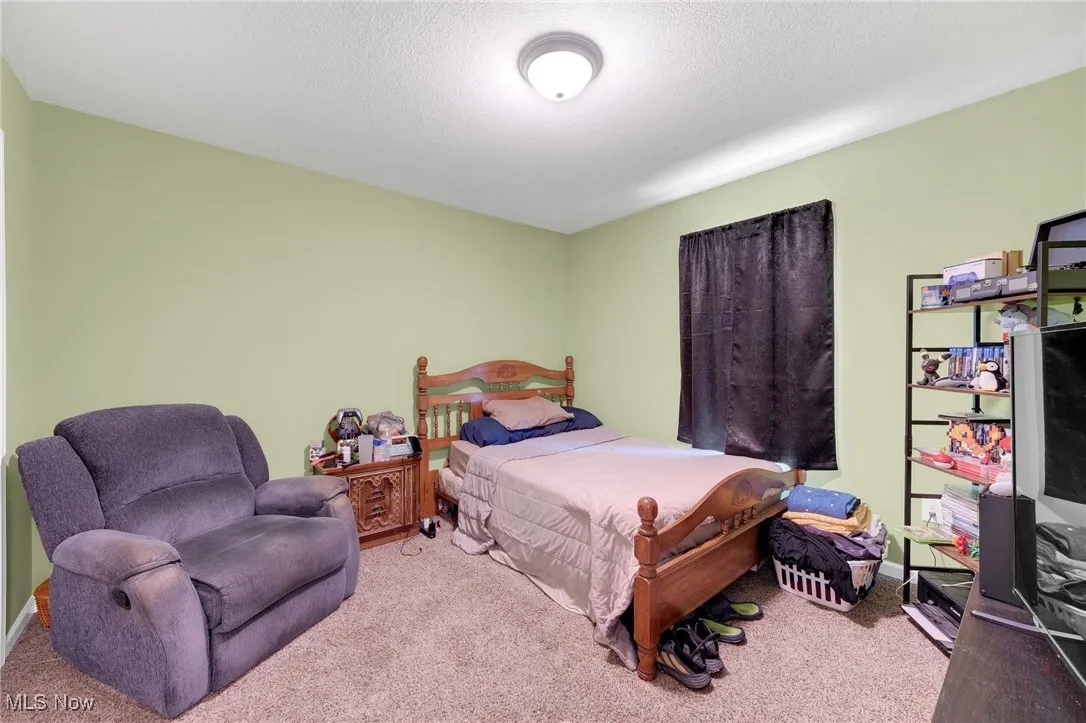 Bedroom featuring carpet flooring