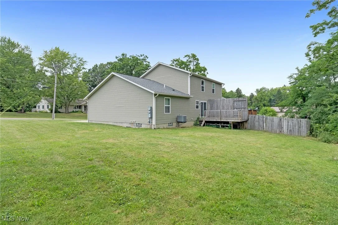 Back of property featuring a deck