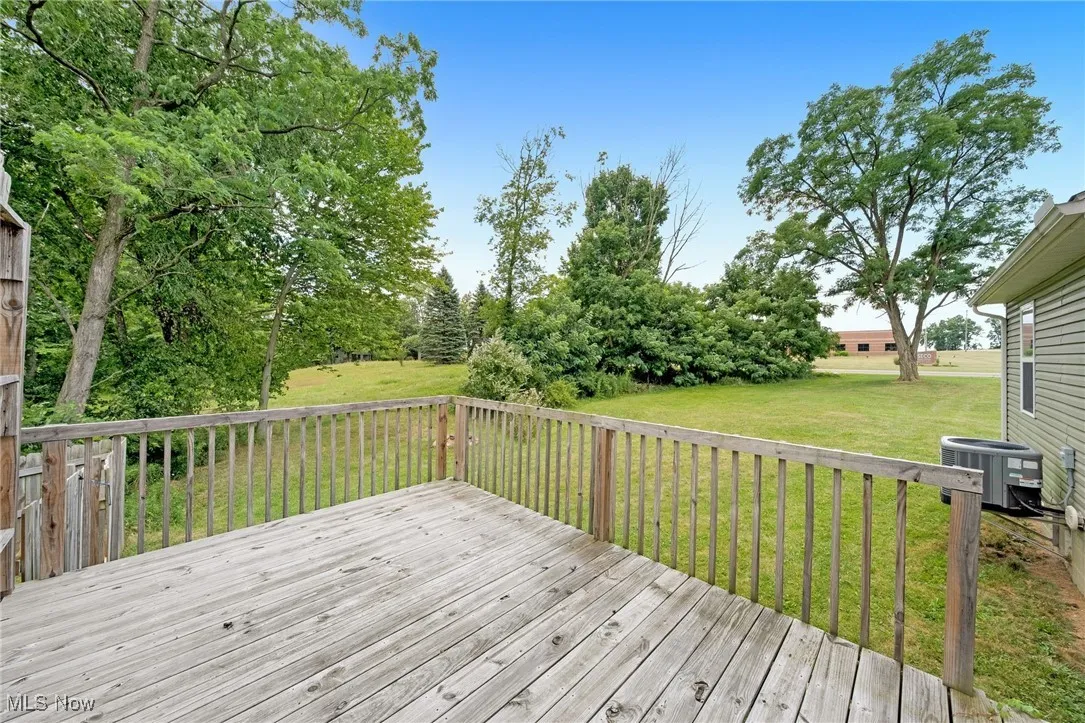 Deck featuring a lawn