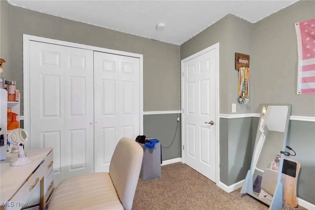 Office space featuring carpet and baseboards