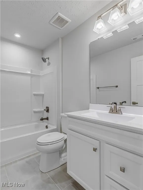 Second floor full bath with vanity, special lighting, tub / shower combo and commode