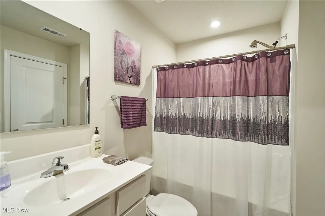 Full bathroom featuring vanity and shower / tub combo