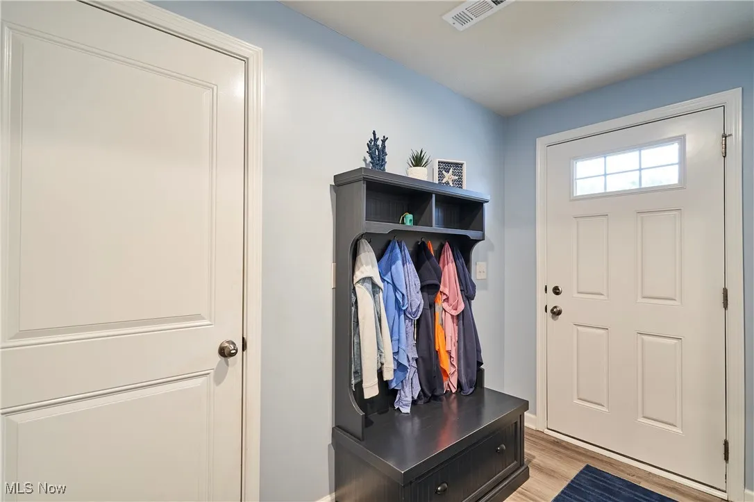 Mudroom with light wood-type flooring