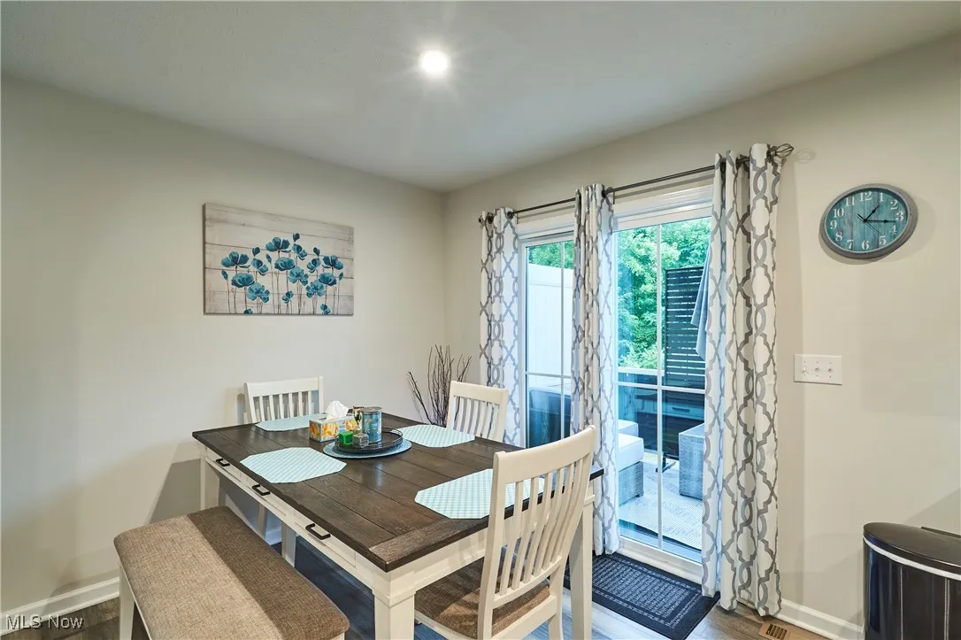Dining room featuring wood finished floors and baseboards