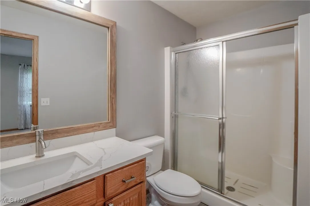 Master Bathroom featuring a stall shower and vanity