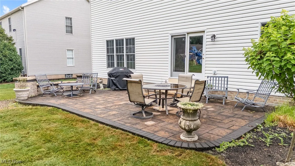 View of patio off kitchen area with grilling area