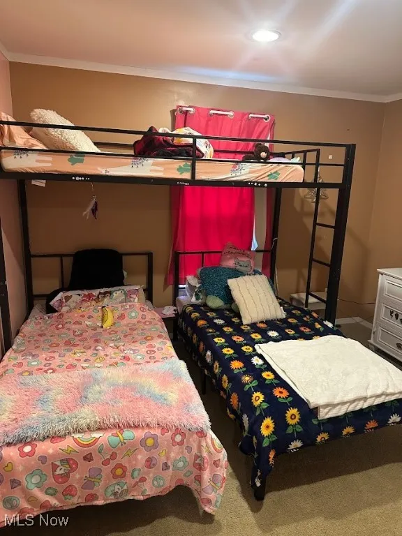 Bedroom with ornamental molding, carpet, and recessed lighting