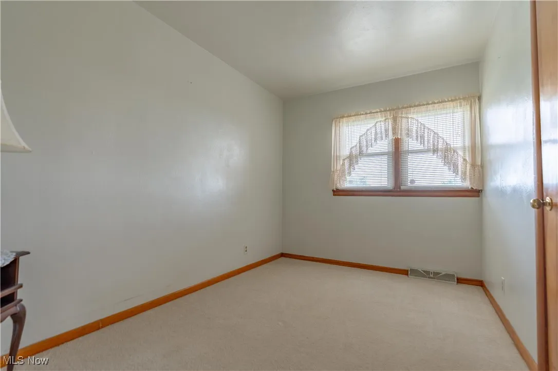 Unfurnished bedroom with carpet floors