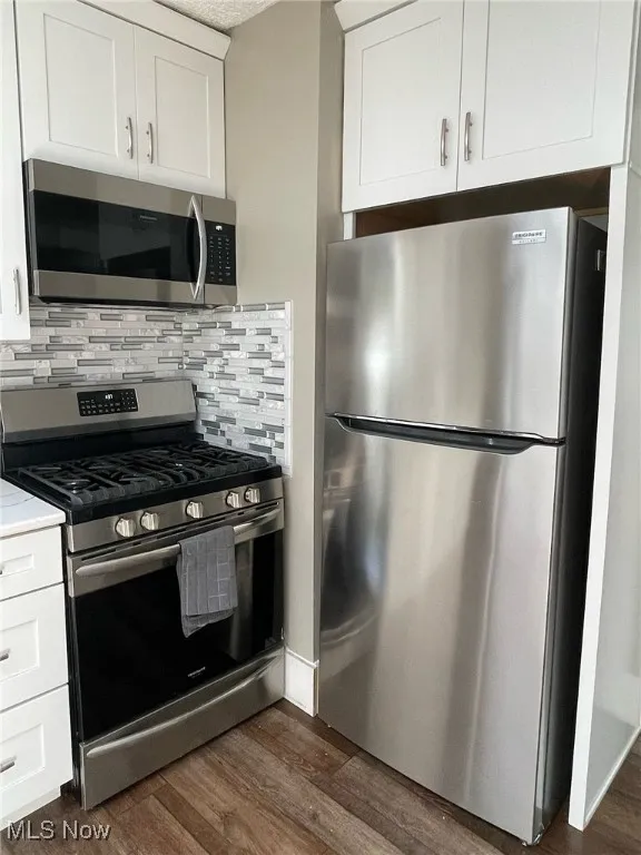 Frigidaire Gallery appliances include gas range, refigerator and over-the-range microwave.